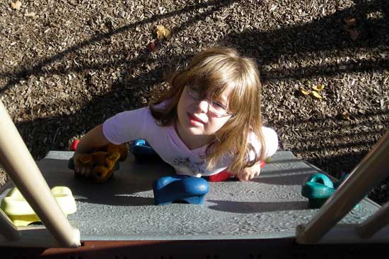 Rachel on the rock climbing device